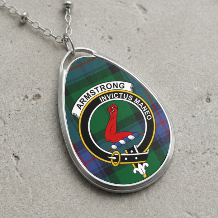 Armstrong clan Scottish tartan necklace with clan crest on tartan background