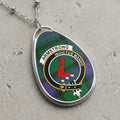Armstrong clan Scottish tartan necklace with clan crest on tartan background