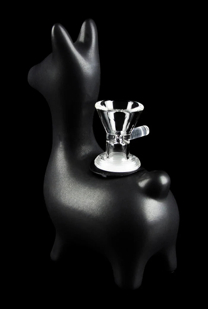 Front three-quarter view of the black Art of Smoke Alpaca Bubbler with a clear glass bowl mounted on the alpaca's back against a black background