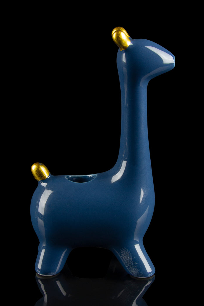 Blue ceramic llama pipe with gold accents, studio shot on a reflective surface."