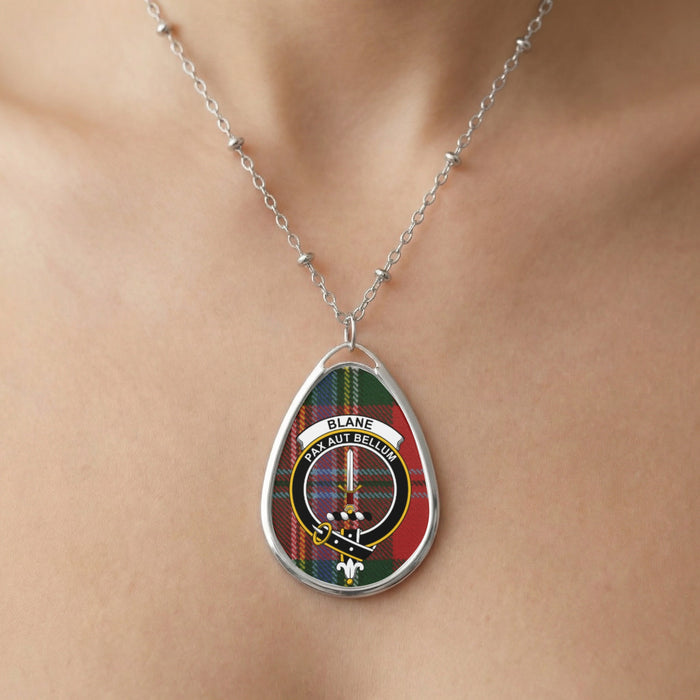 Close-up of Blane clan tartan pendant necklace with crest design