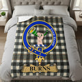 Burns clan crest with hand and horn on tartan throw blanket