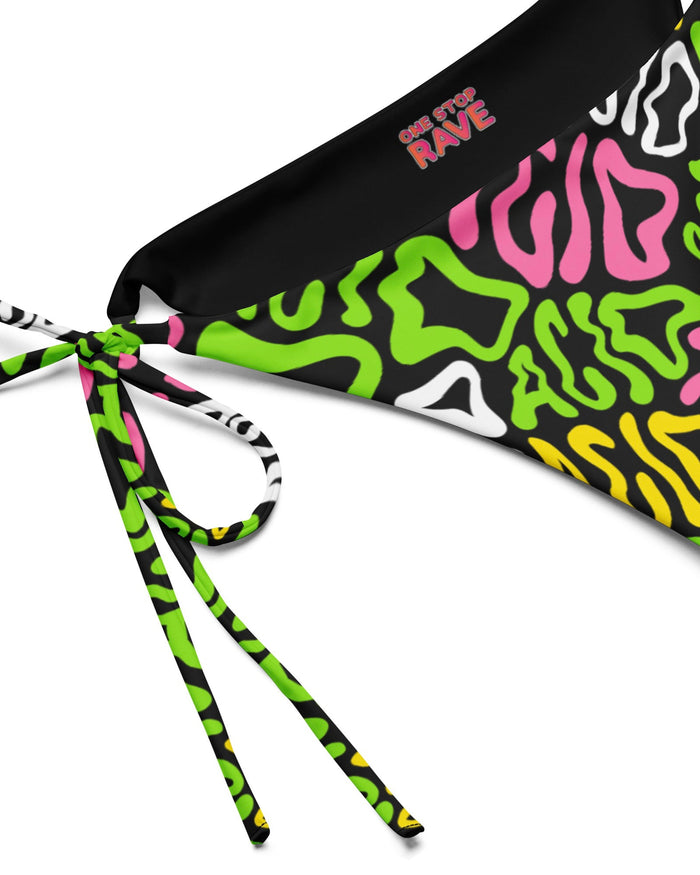 Close up of the Candy Acid Recycled String Bottoms by One Stop Rave on a white background.