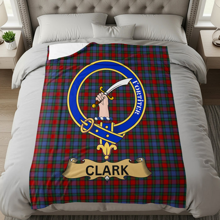 Clark crest with hand holding sword and Fortiter motto on tartan throw