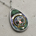 Clephan clan Scottish tartan necklace with clan crest on tartan background