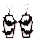 Black coffin-shaped earrings with cut-out bat design on a white background