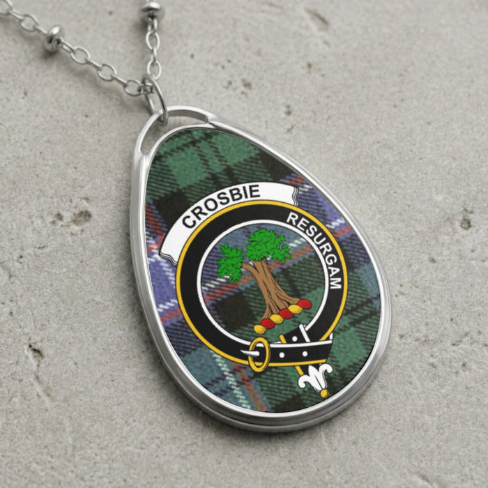 Crosbie clan Scottish tartan necklace with clan crest on tartan background