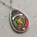 Cumming clan Scottish tartan necklace with clan crest on tartan background