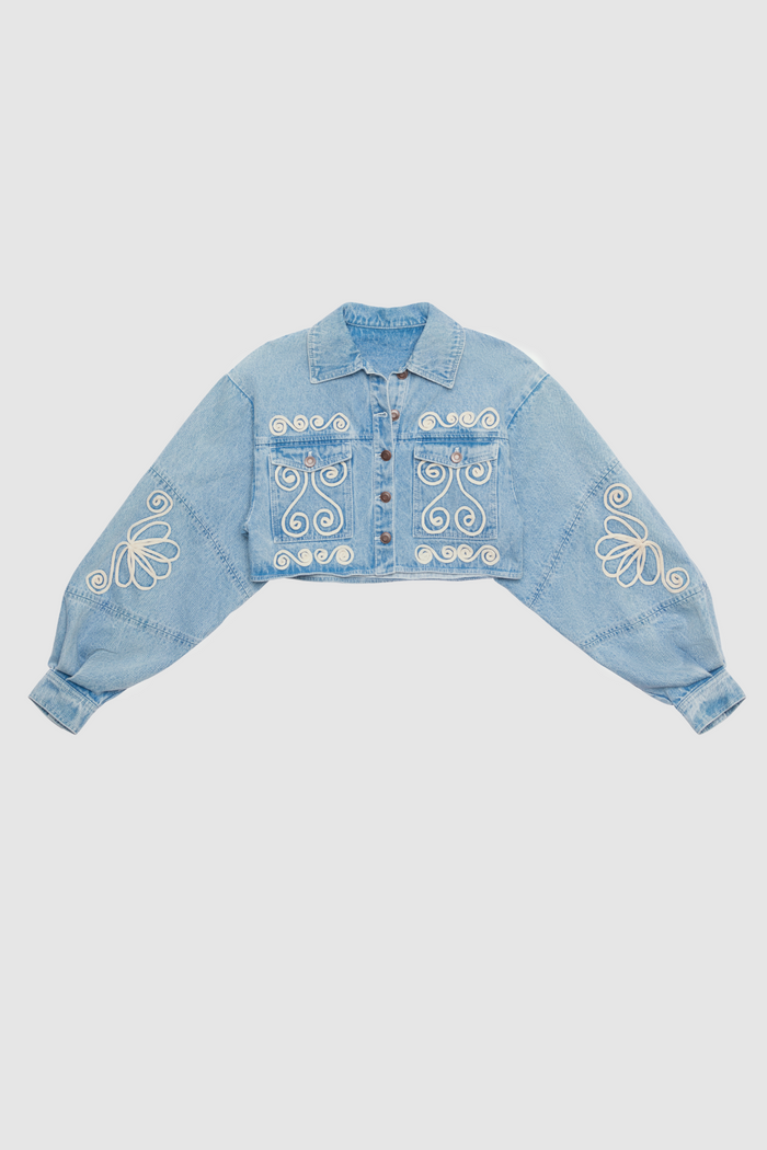 Cropped cotton denim jacket with oversized balloon sleeves and custom embroidery by The Wolf Gang, pairs with matching barrel jeans.