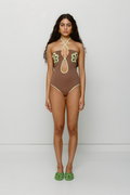 Hand-crocheted halter neck one-piece swimsuit with floral patterns and contrast piping by The Wolf Gang, limited edition design.