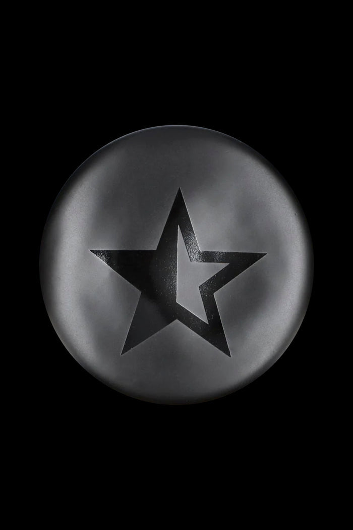 Black star-shaped emblem on a metallic gray circular background.