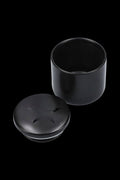 Black cannabis storage jar with lid separated.