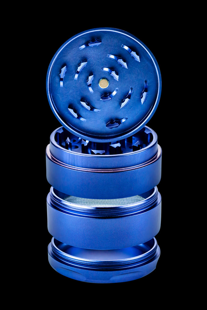 Blue four-piece metal grinder for cannabis.