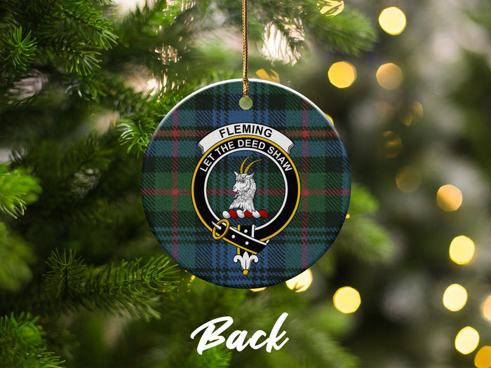 Fleming crest and motto on round tartan ceramic ornament — close-up
