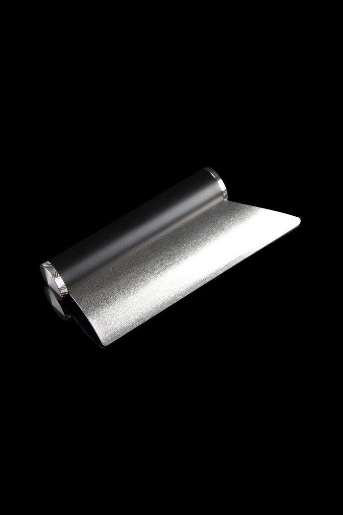 Sleek metal rolling tray for cannabis.