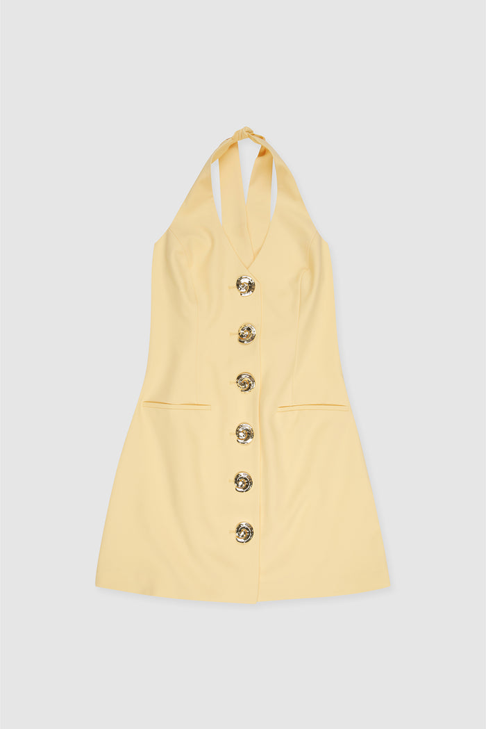 Best-selling women’s Butter Yellow Irida mini halter neck vest dress with gold swirl buttons, tie-back, and front welt pocket—wear alone or with matching pants.