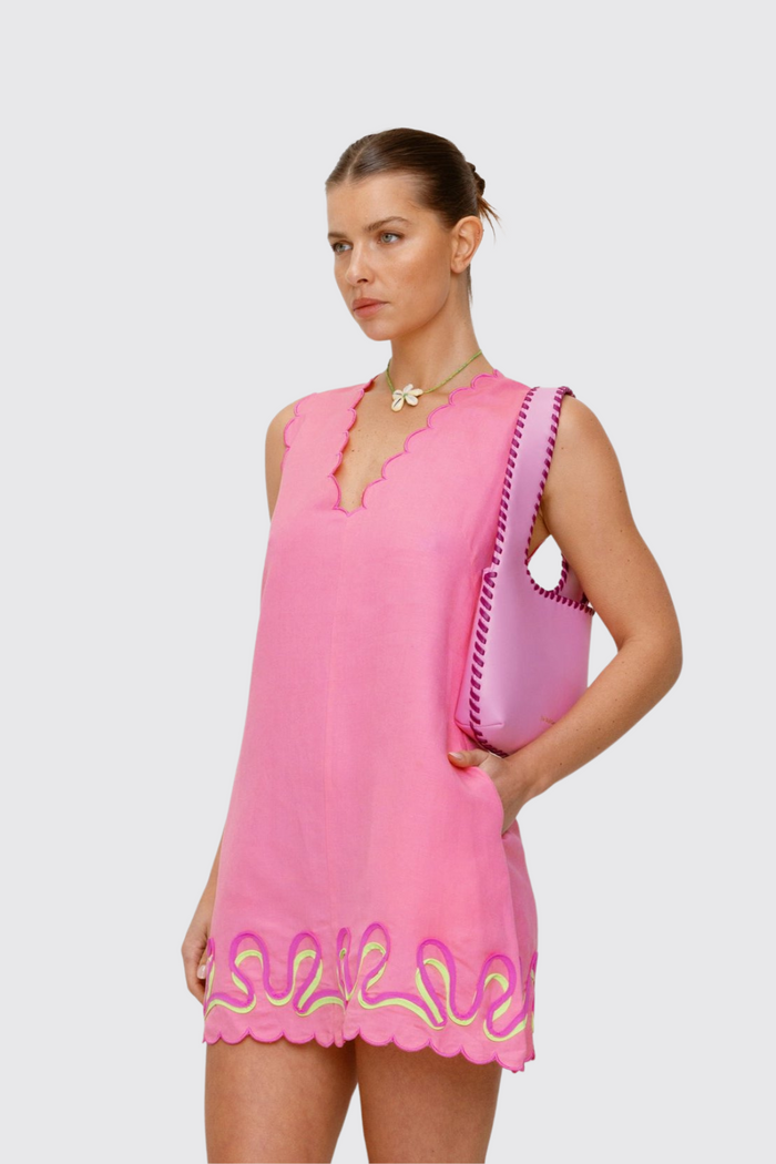 Women’s Candy Pink Mara Shoulder Bag in 100 percent leather with twisted strap contrast binding and magnetic snap closure for everyday wear.