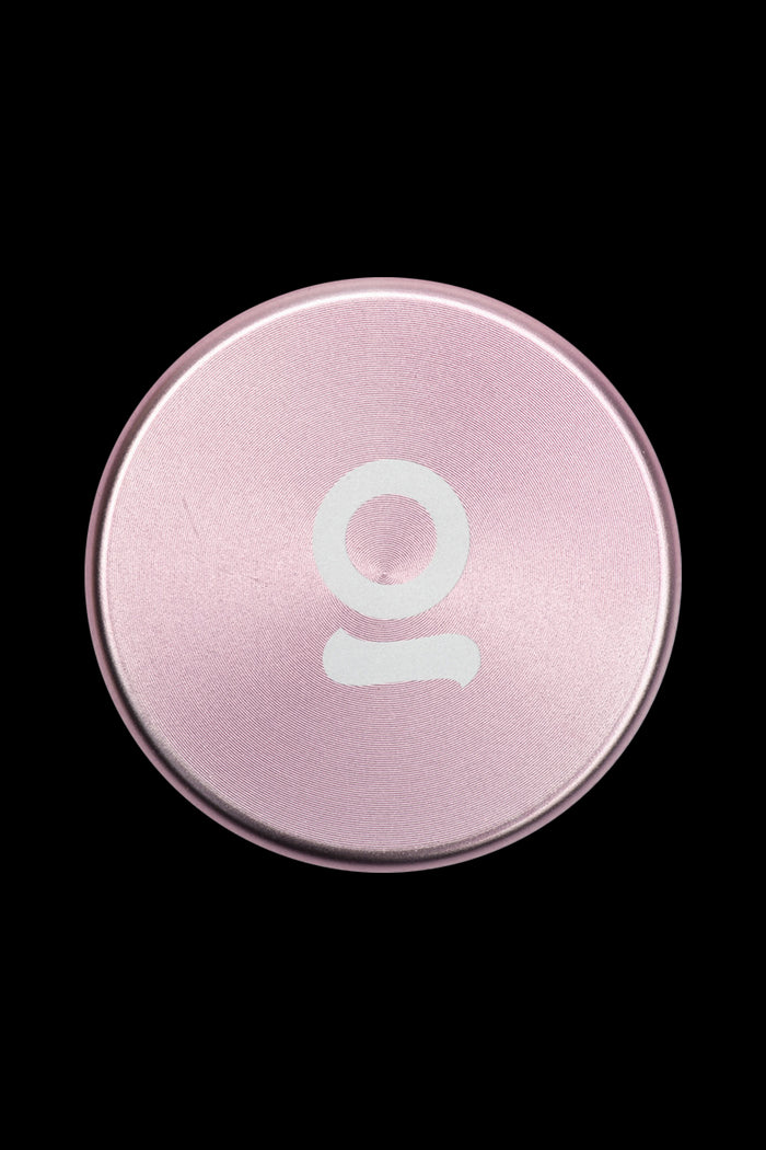 Pale pink cannabis oil vial with a white stylized “O” logo.