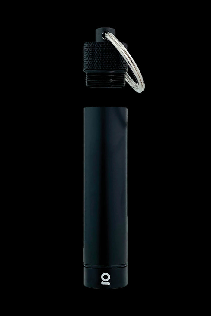 Black, cylindrical cannabis oil applicator with a keyring and visible “o” logo.