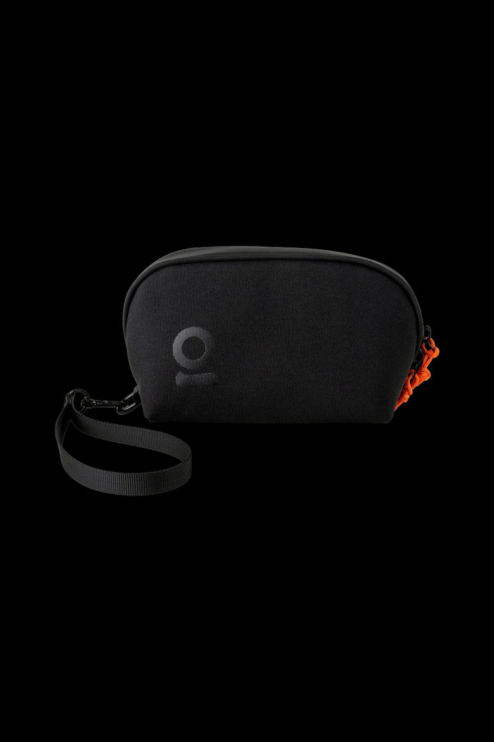 Black cannabis accessories case with orange zipper pull and carrying strap.