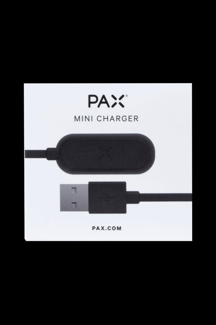 PAX mini charger with USB connection on a white card. <start_of_image>