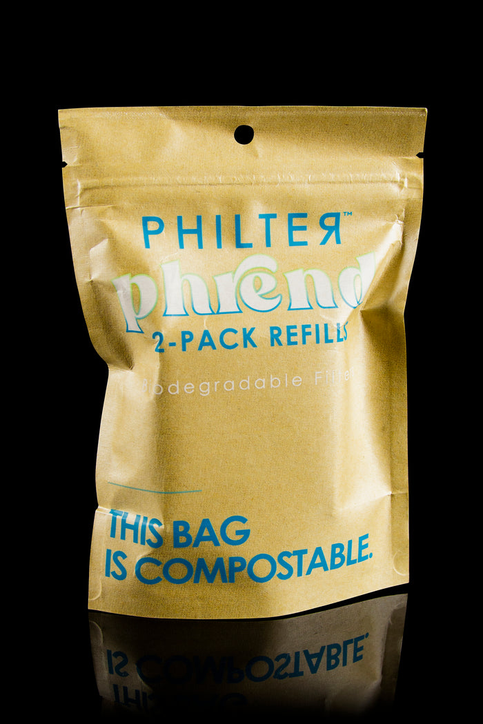 Gold, resealable bag labeled “Philter” and “2-Pack Refills,” advertising compostable filters.