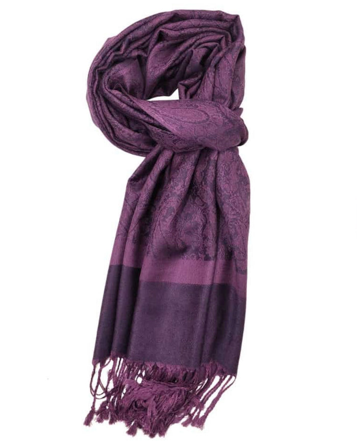 Purple scarf with intricate patterns and fringes on a white background