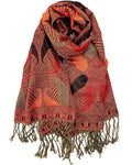 Decorative scarf with intricate patterns and fringes on a white background