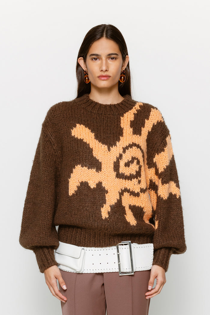 Relaxed fit women’s knit jumper in earthy brown with custom sun motif