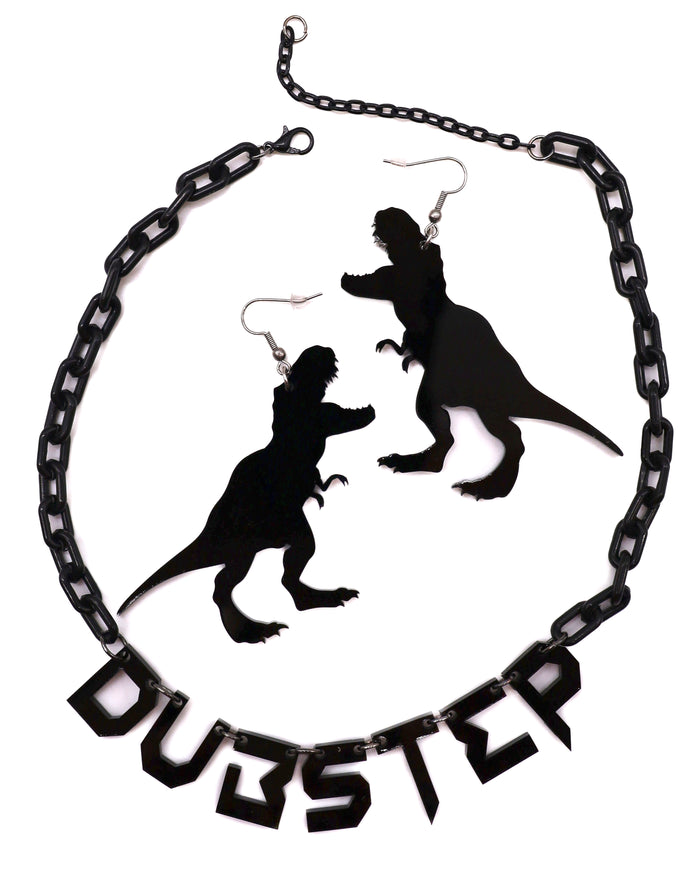 Close-up view of the T-Wrecked Earrings in black, paired with the One Stop Rave Dubstep Choker.