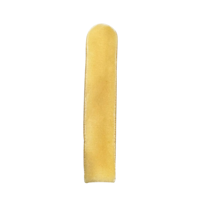 Tatty Yak original yak milk chew for dogs, a hard pale cream chew on a plain background