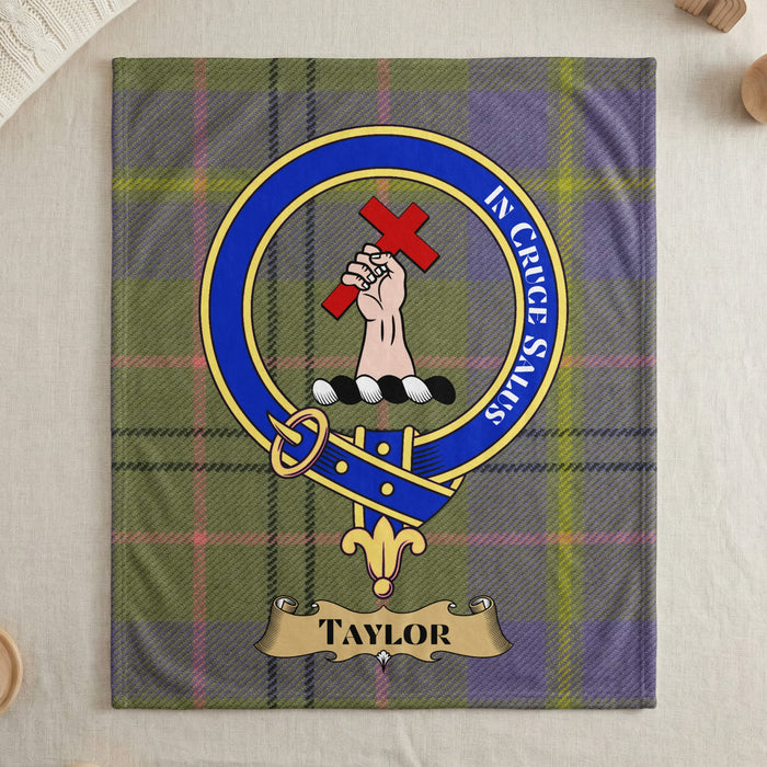 Taylor clan crest and motto on tartan throw blanket — draped display