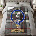Thomson throw with crest and name on a bed