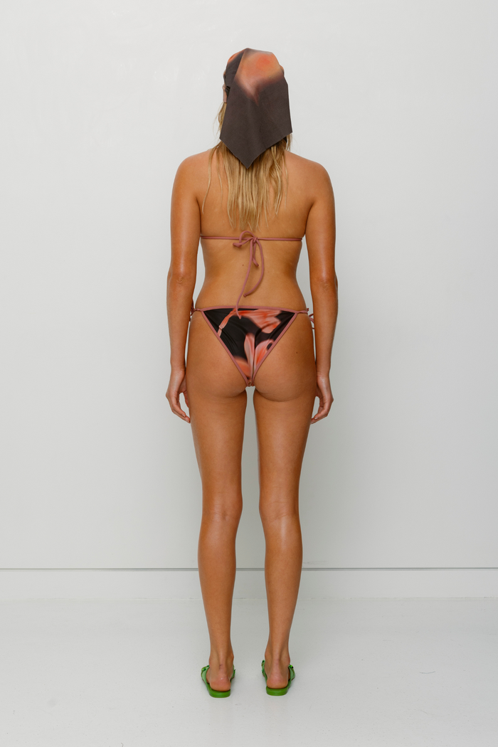 Brown floral triangle bikini set with beaded drawstrings and adjustable ties by The Wolf Gang, perfect for summer getaways.