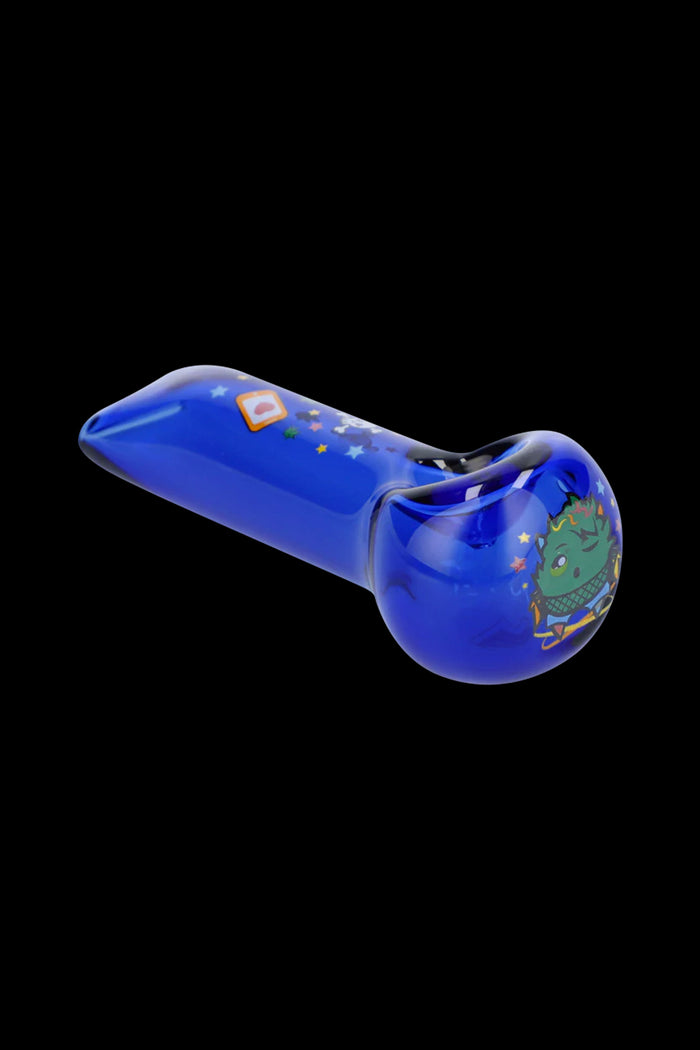 Angled close-up of a blue Wido Strain Hand Pipe showing a rounded bowl with a green cartoon character decal and scattered star details on a black background