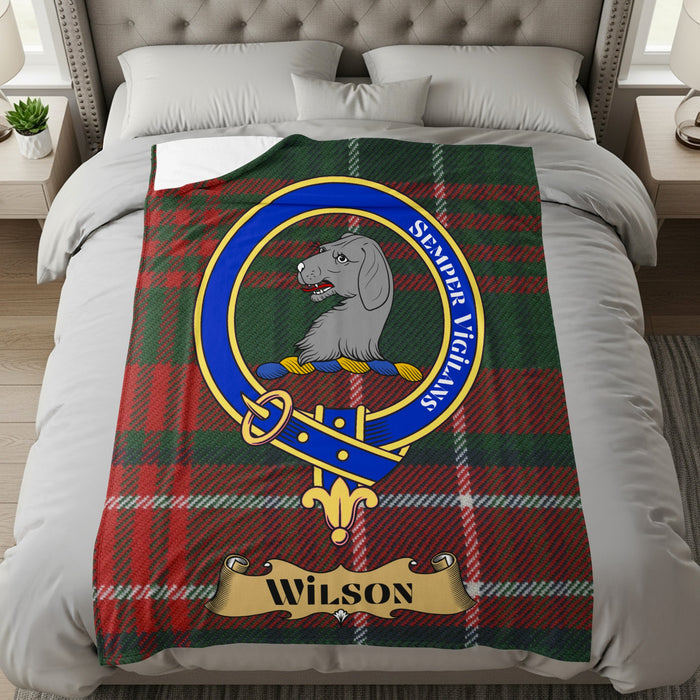 Wilson family crest and name on a tartan background throw blanket