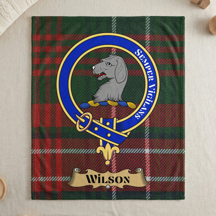 Wilson clan crest with hound on tartan throw blanket — draped display