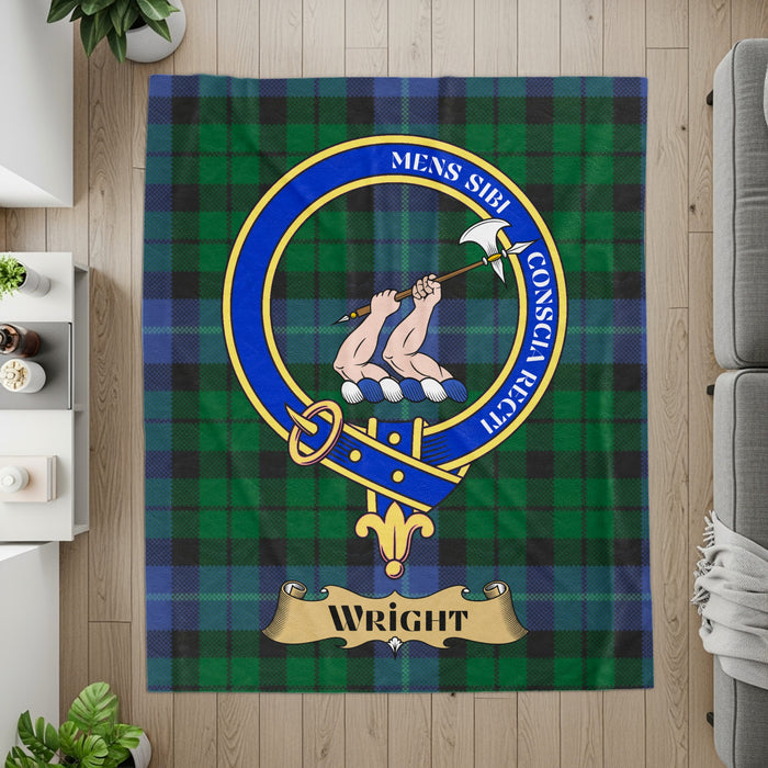 Wright crest with hands holding axe on tartan printed throw — detail